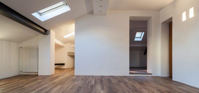 loft conversion with white walls and parquet flooring