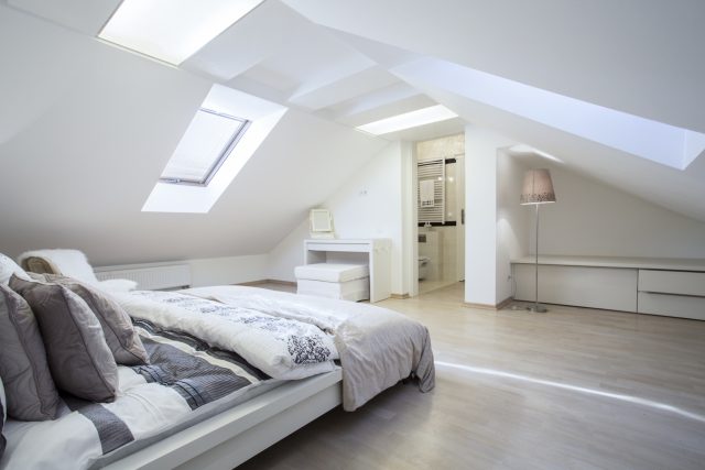 Interior of luxury loft space with double bed